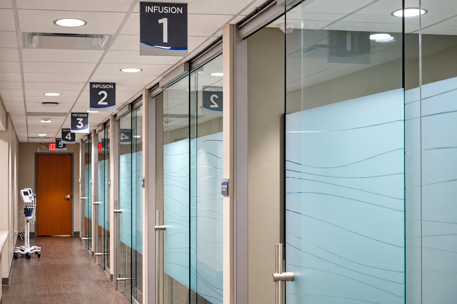 Glass-front infusion treatment rooms at Primary Health Infusion Center