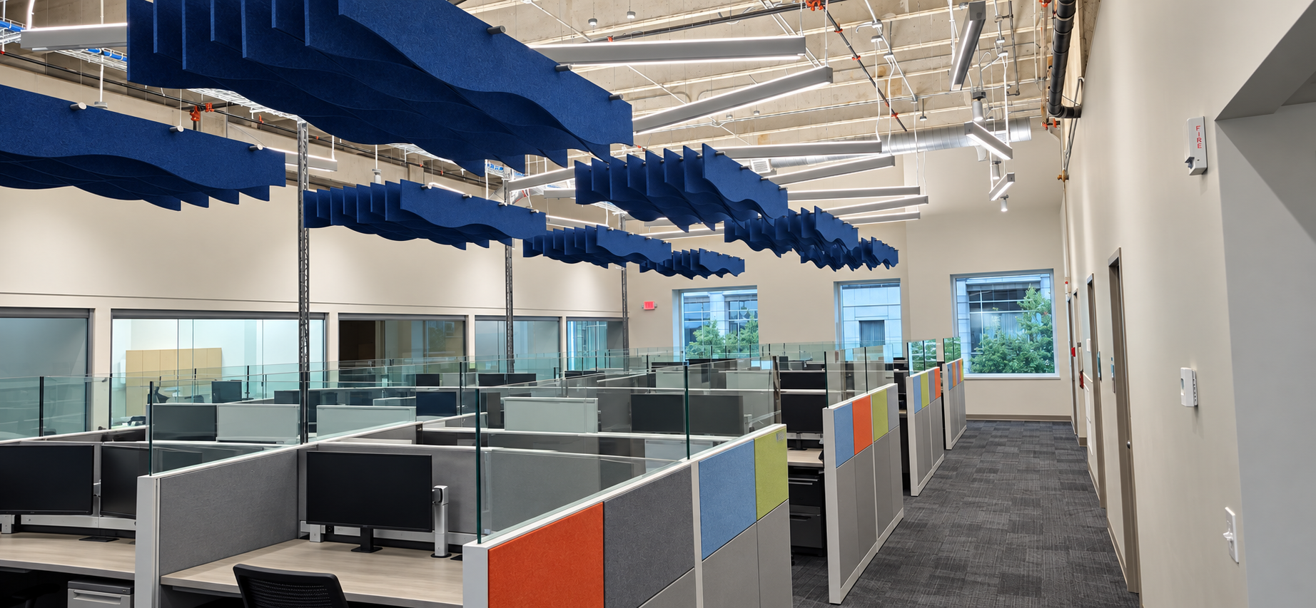 Primary Health Solutions open office space with acoustic ceiling baffles